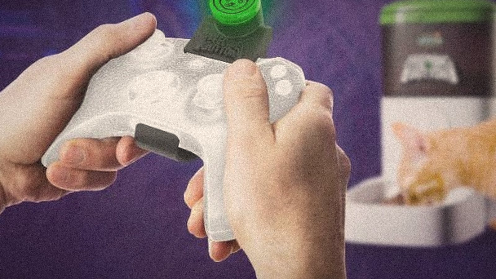 The Feeding Button — a gamepad with the feeding key, and a cat at the dispenser